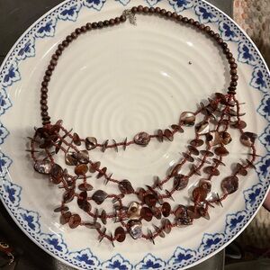 Elegant Beaded Necklace with Red and Brown Tones